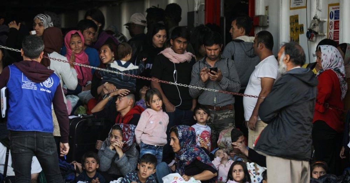 Refugees and migrants arrive on a passenger ferry from the island of Samos, at the port of Elefsina, Athens, Oct. 22, 2019. (REUTERS Photo)