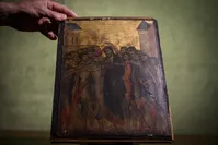 This photo taken on September 23, 2019 in Paris shows a painting entitled ,the Mocking of Christ, by the late 13th century Florentine artist Cenni di Pepo also known as Cimabue (AFP Photo)