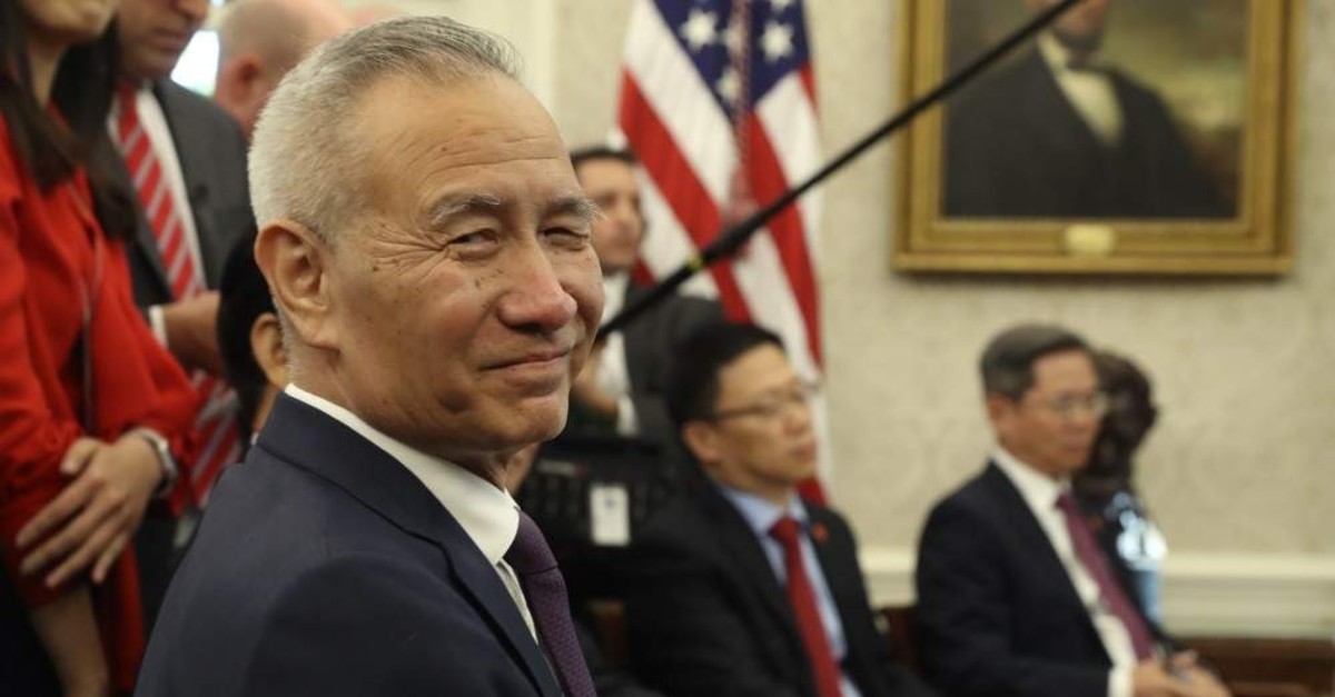 In this Oct. 11, 2019, file photo, Chinese Vice Premier Liu He listens during a meeting in the Oval Office of the White House with U.S. President Donald Trump in Washington. (AP Photo)