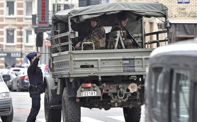 Police and military patrolling the city center after the explosions in Brussels