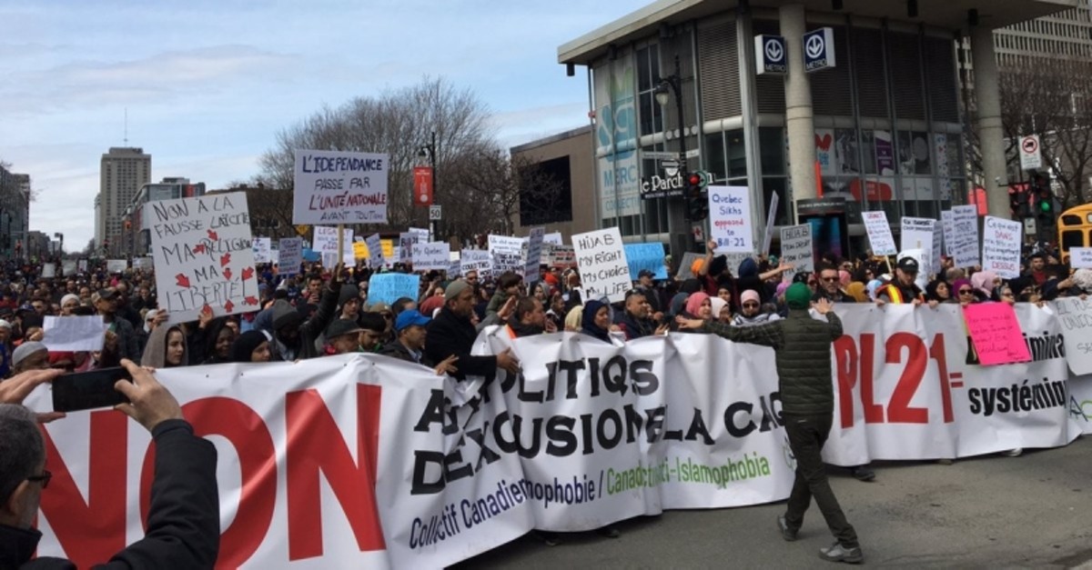 Demonstrators march to protest the proposal in Quebec, Canada. (IHA Photo)