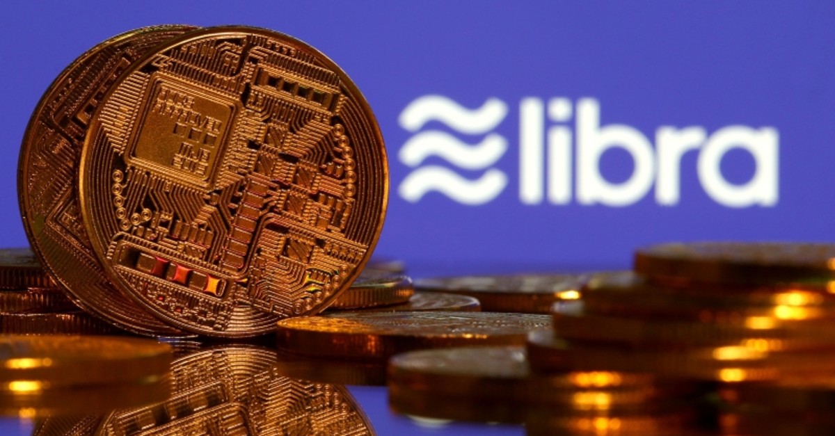 Representations of virtual currency are displayed in front of the Libra logo in this illustration picture, June 21, 2019. (Reuters Photo)