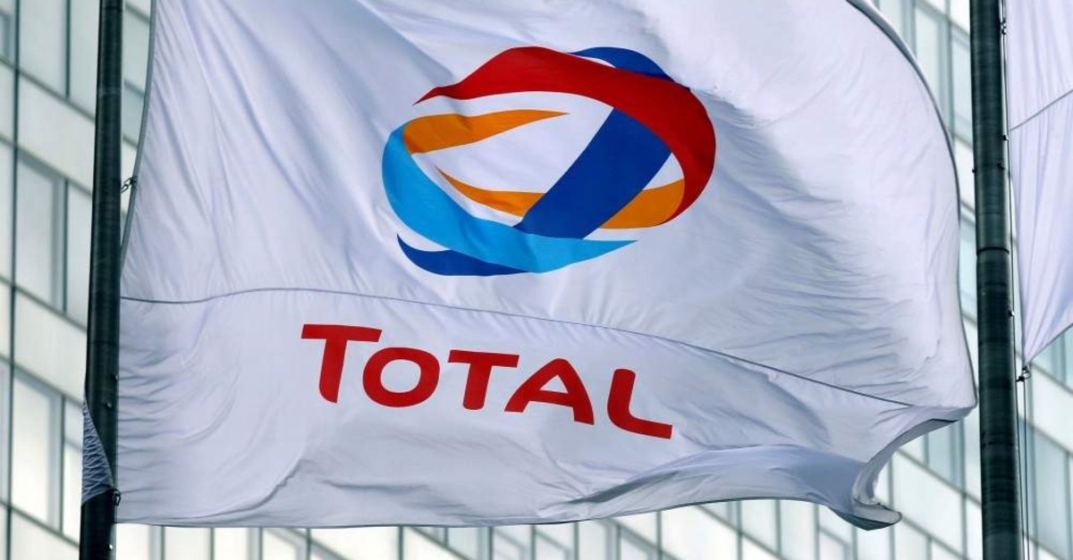 The logo of French oil giant Total on a flag at a financial district near Paris, May 16, 2018. (Reuters Photo)