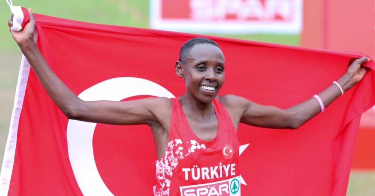 Yasemin Can of Turkey celebrates after crossing the finish line to win the Women's race during the European Cross Country Championships at the Bela Vista park in Lisbon, Sunday, Dec. 8, 2019. (AP Photo)