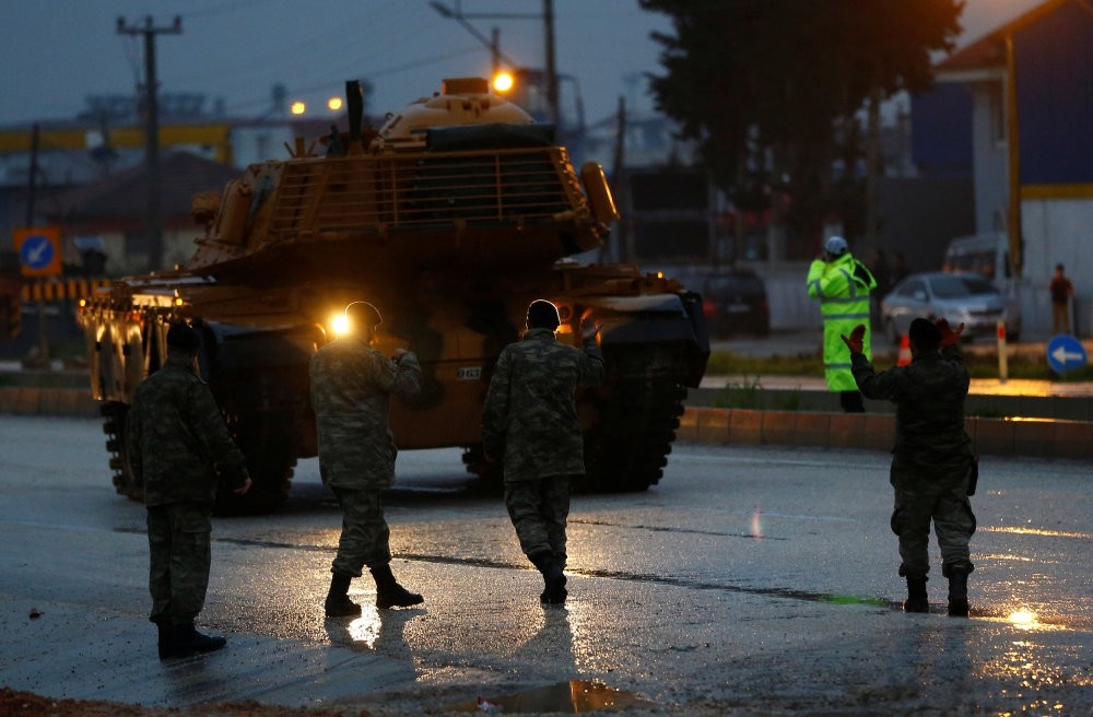 A Turkish military convoy arrives at an army base near the Turkish-Syrian border, Hatay province, Turkey, Jan. 17. 