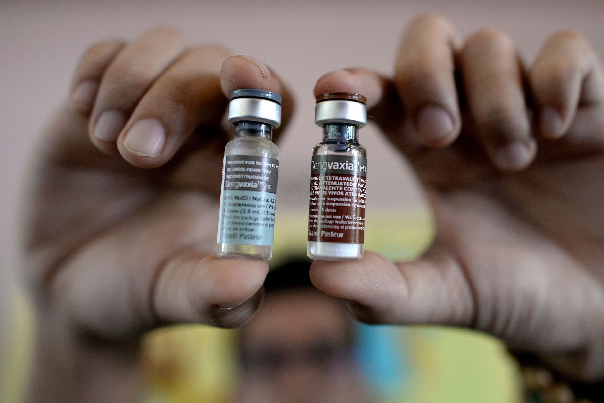 This file photo taken on April 4, 2016 shows a nurse showing vials of the anti-dengue vaccine Dengvaxia, developed by French medical giant Sanofi, during a vaccination program at an elementary school in Manila. (AFP Photo)
