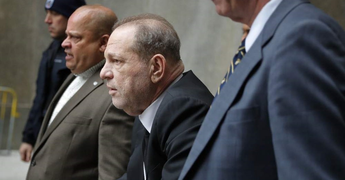 Harvey Weinstein, third from left, leaves court in New York, Monday, Jan. 6, 2020. (AP Photo)