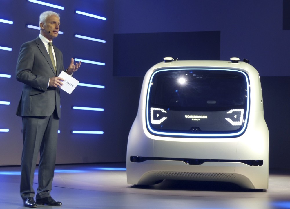 Volkswagen CEO Matthias Mueller presents a Sedric Concept car during a Volkswagen event prior to the 87th Geneva Auto Show in Switzerland.