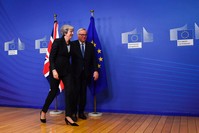 EU Commission President Jean-Claude Juncker and British Prime Minister Theresa May leave after a press briefing during a meeting at the EU Headquarters in Brussels, Nov. 21. 