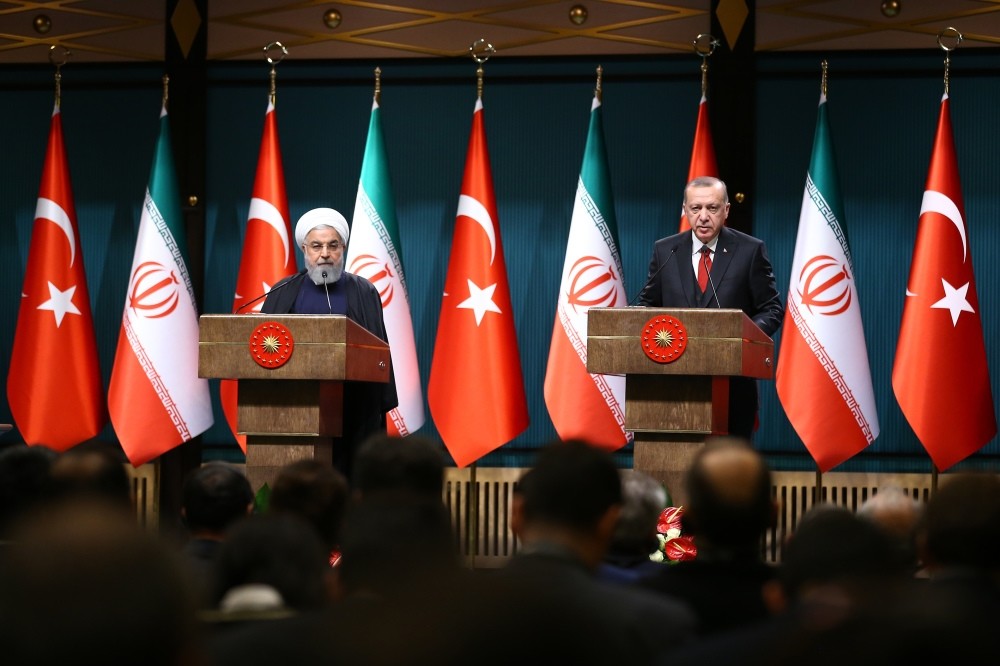 President Recep Tayyip Erdou011fan (R) and his Iranian counterpart Hassan Rouhani hold a joint news conference after their meeting in Ankara yesterday.