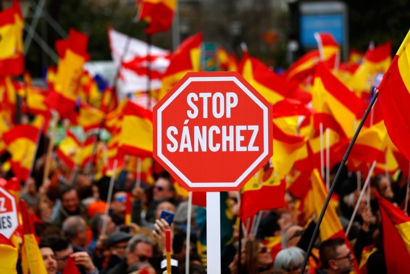 Demonstrators hold banners and Spanish flags during a protest in Madrid, Spain, on Sunday, Feb.10, 2019. (AP Photo)