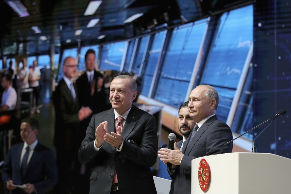 President Recep Tayyip Erdou011fan (L) and Russian President Vladimir Putin (R) applaud as they attend an event in Istanbul marking the completion of one of the phases of the TurkStream natural gas pipeline, Nov. 19.