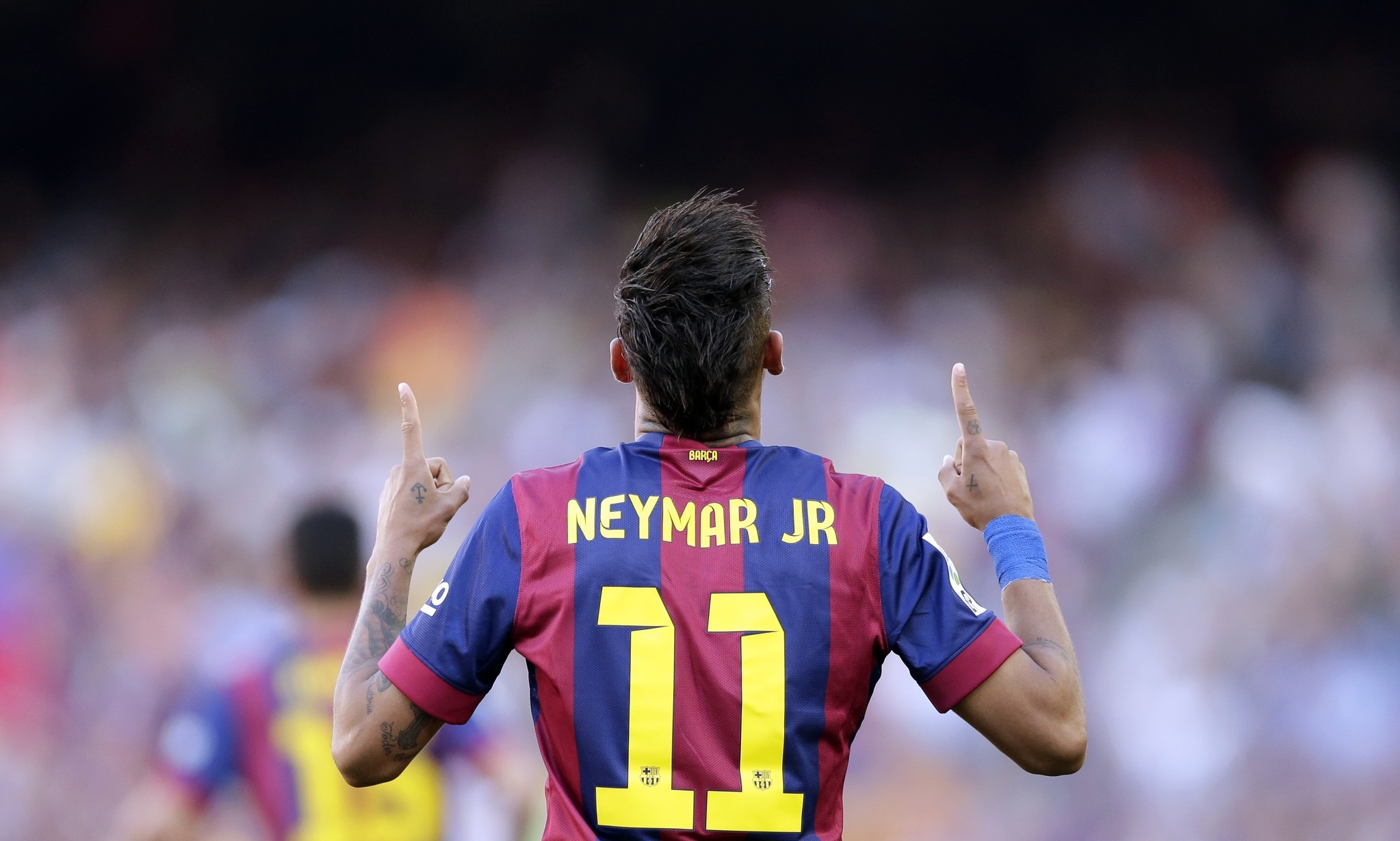 In this May 9, 2015 file photo, FC Barcelona's Neymar celebrates after scoring against Real Sociedad during a Spanish La Liga soccer match at the Camp Nou stadium. (AP Photo)
