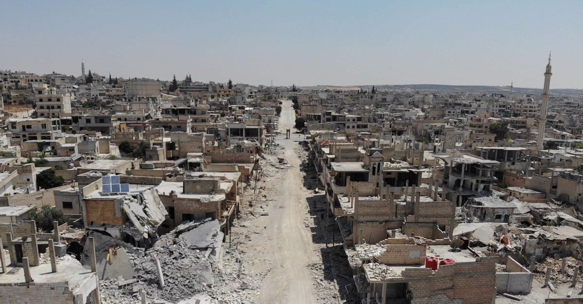 An aerial view shows buildings destroyed by Syrian regime attacks in the town of Khan Sheikhun in the southern countryside of Idlib, Aug. 4, 2019.