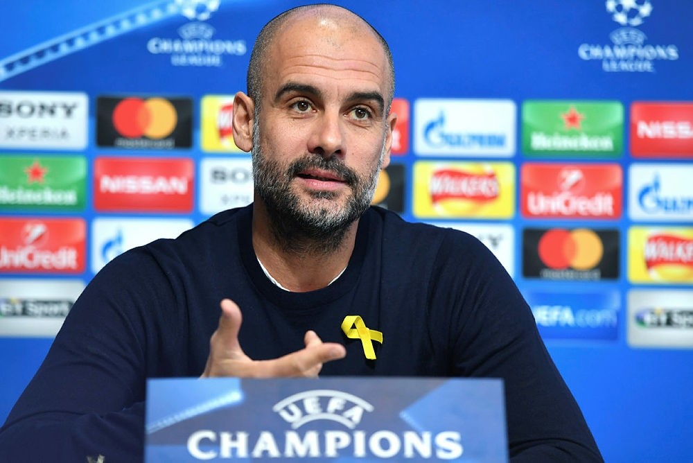 Manchester City's Spanish manager Pep Guardiola wears a yellow ribbon pinned to his jumper as he attends a press conference at the City Football Academy in Manchester, U.K., March 6, 2018. (EPA Photo)