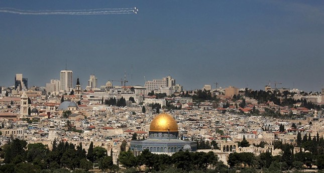 A file picture dated 18 April 2010 shows a view of the Old City of Jerusalem as seen form the Mount of Olives in East Jerusalem as an acrobatic Israeli flying team flys over the city. (EPA Photo)