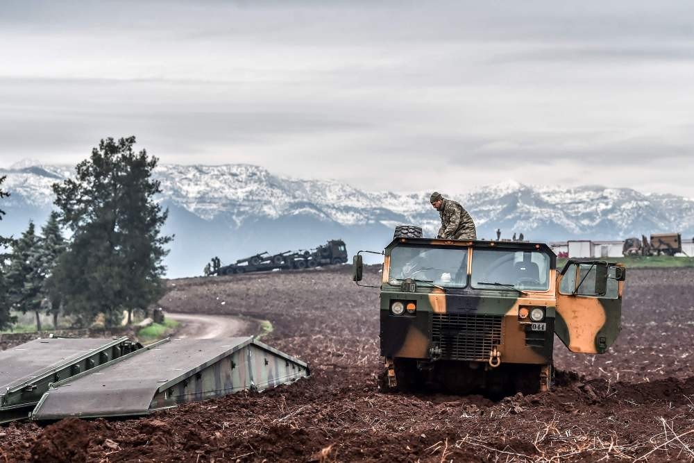 Turkish troops wait near the Syrian border at Hassa, Hatay, as part of Operation Olive Branch against YPG terrorists in northern Syria, Jan. 24.