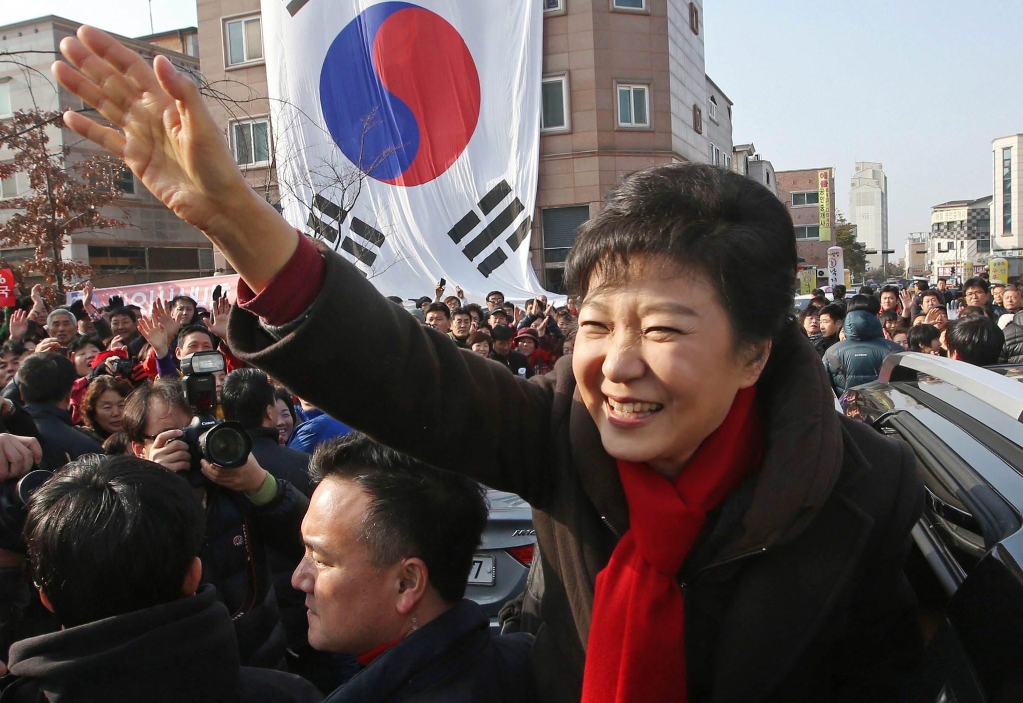 Ex-South Korean president Park Geun-hye waves to supporters during her election campaign rally in Hwaseong, south of Seoul, South Korea, Dec. 17, 2012. (AP Photo)