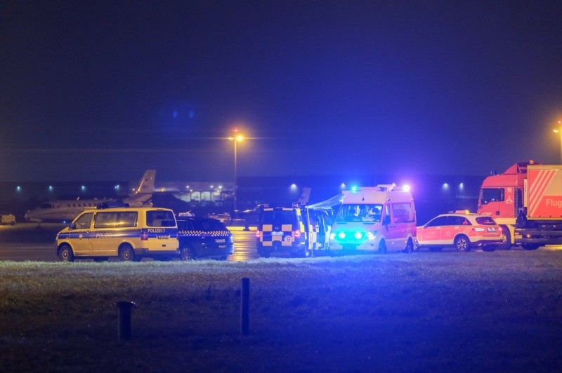 Vehicles of the emergency services are seen at the airport in Hanover on December 29, 2018  (AFP Photo)