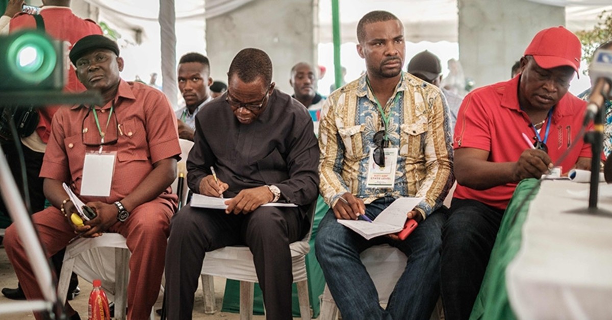 Representatives from parties listen as a collation officer reports the aggregattion total of votes at Rivers State collation centre in Port Harcourt, Southern Nigeria, on Feb. 25, 2019. (AFP Photo)