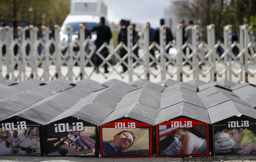 Mock-up coffin displayed during a protest on Friday in front of Iranian Embassy in Ankara against Assad regime's chemical attacks on Idlib (AA Photo)