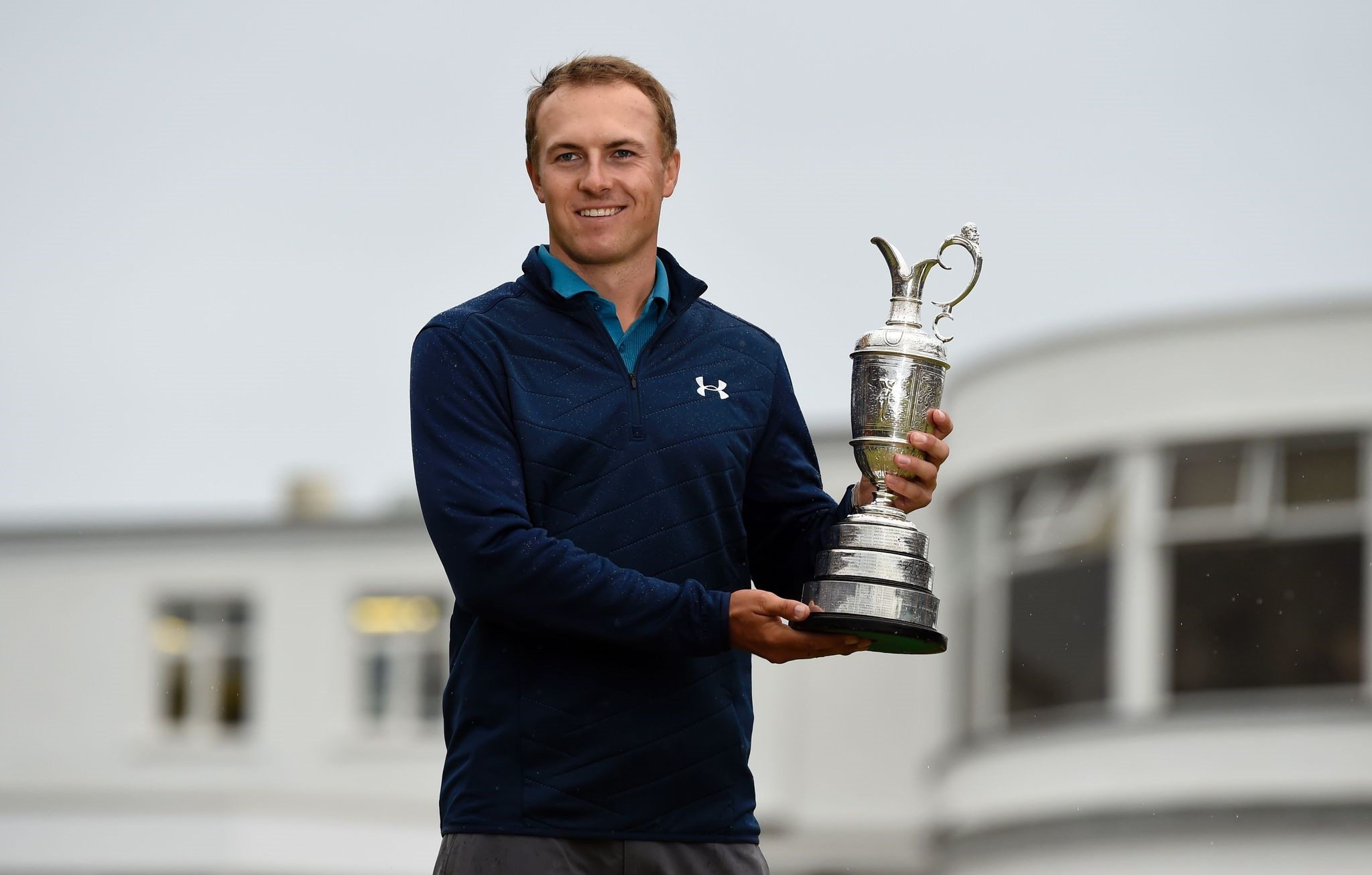 Spieth poses for pictures with the Claret Jug, the trophy for the Champion golfer of the year after winning the 2017 British Open Golf Championship. (AFP Photo)