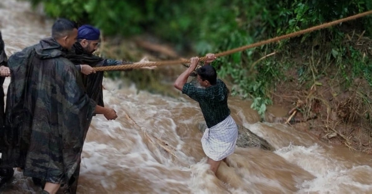 A handout photo by Indian Defense Ministry shows Indian military personnel conducting rescue operations in the flood affected areas in Belgaum/Belagavi district in North Karnataka, India, Aug. 10, 2019. (AP Photo)