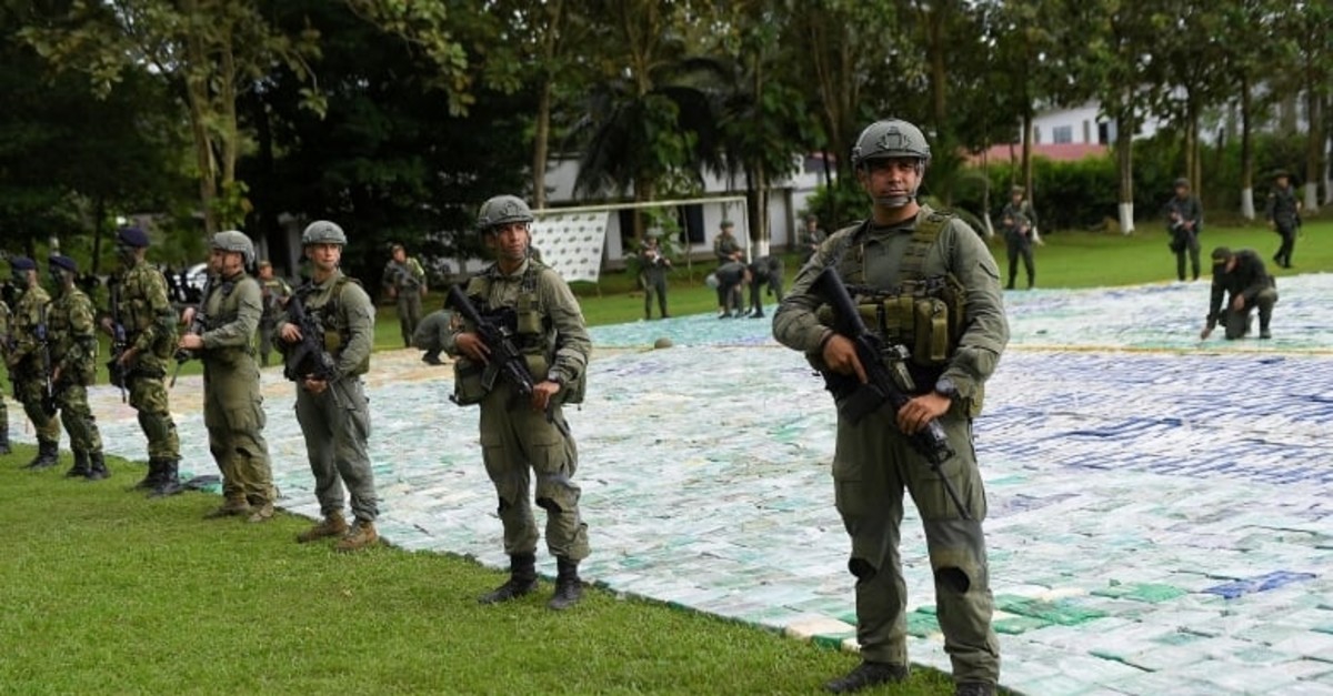 Colombian police and soldiers guard 11 tonnes of seized cocaine in Apartado, Colombia (Reuters File Photo)