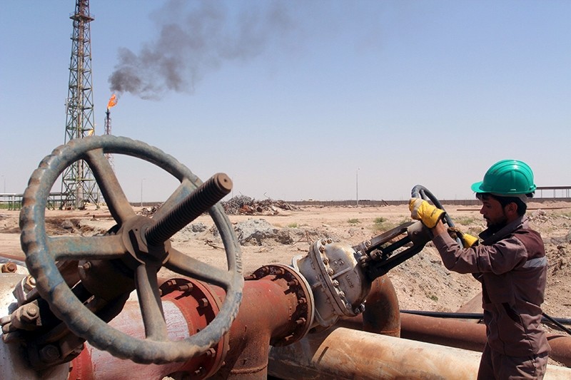 A worker checks the valve of an oil pipe at Al-Sheiba oil refinery in the southern city of Basra, Iraq, April 17, 2016. (Reuters Photo)