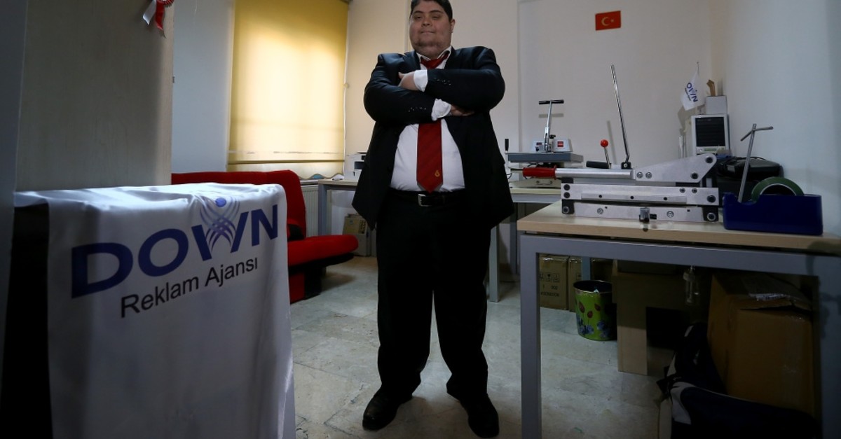 Ozan Ulusoy poses in his workshop, March 20, 2019.