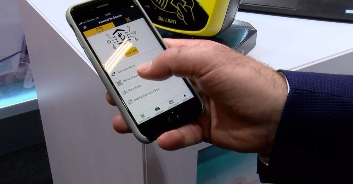 Bus fare payment using QR code was demonstrated at the EMITT trade show, Istanbul, Feb. 2, 2020. (DHA Photo)
