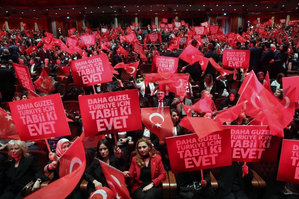 People holding banners and waving flags during a rally held by President Erdou011fan as part of the campaign ahead the constitutioal referendum in April 16, Ankara, March 29.