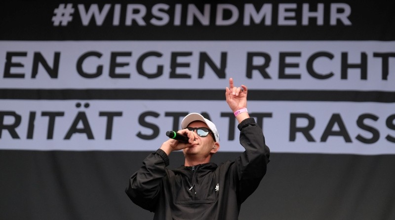 HipHop singer Trettmann performs on stage during the concert to say 'No' to the far right on September 3, 2018 in Chemnitz, eastern Germany.