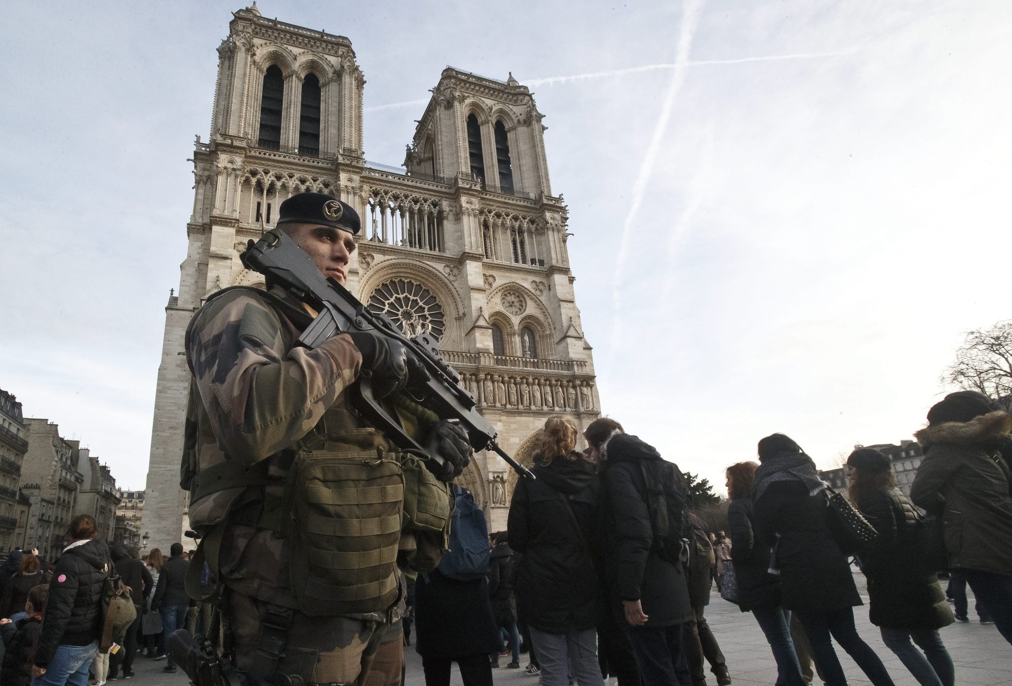 A soldier patrols at the Notre Dame cathedral in Paris, Dec. 30, 2015. (AP Photo)