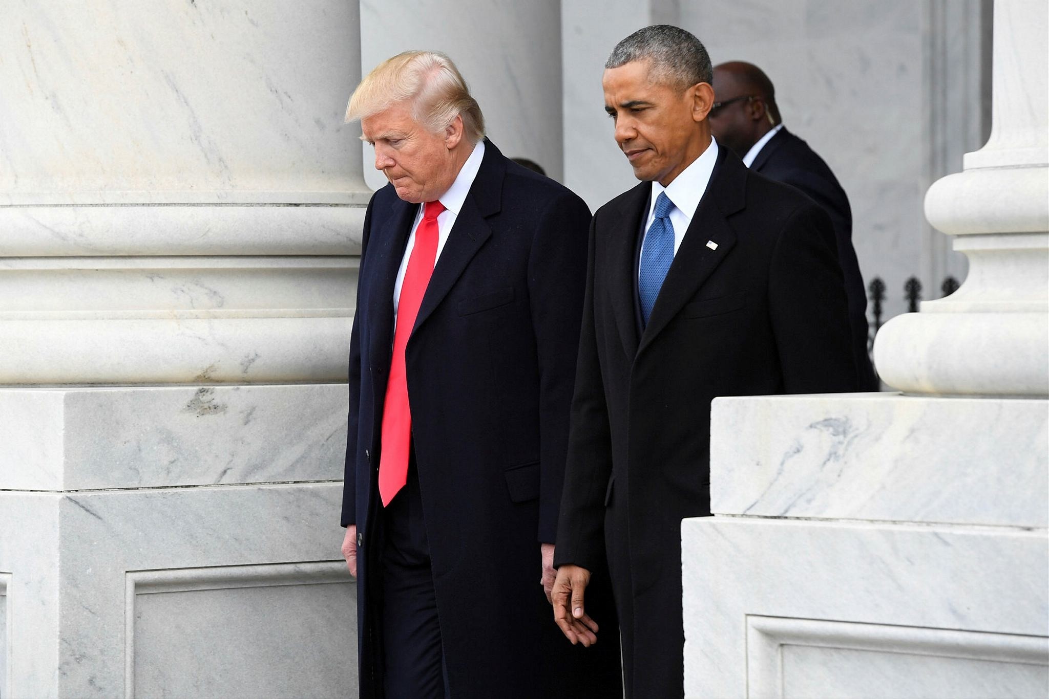 U.S. President Donald Trump and former President Barack Obama walk out of the East front in Washington, D.C., U.S. January 20, 2017. (REUTERS Photo)