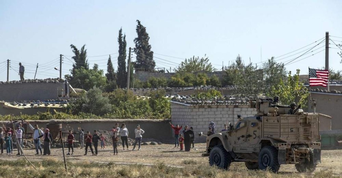 U.S. soldiers take part in a joint convoy with YPG terrorists, patrolling near the town of Al-Muabbadah, Nov. 9, 2019. (AFP)
