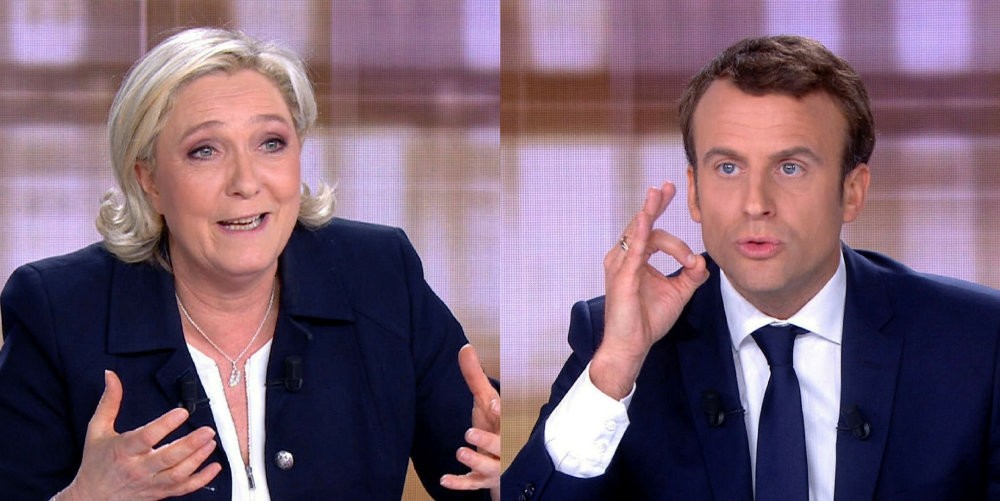 French President Emmanuel Macron and far-right leader Marine Le Pen face off in a final televised debate, May 3, 2017.