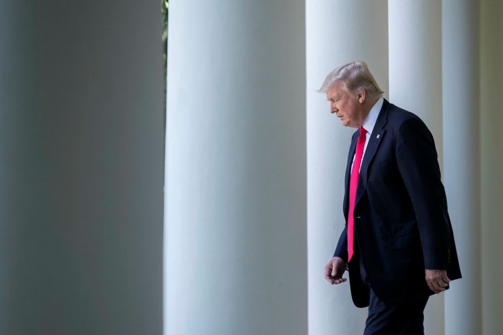 U.S. President Donald Trump walks from the Oval Office to announce the country's withdrawal from the Paris climate accord at the White House in Washington, DC, June 1.