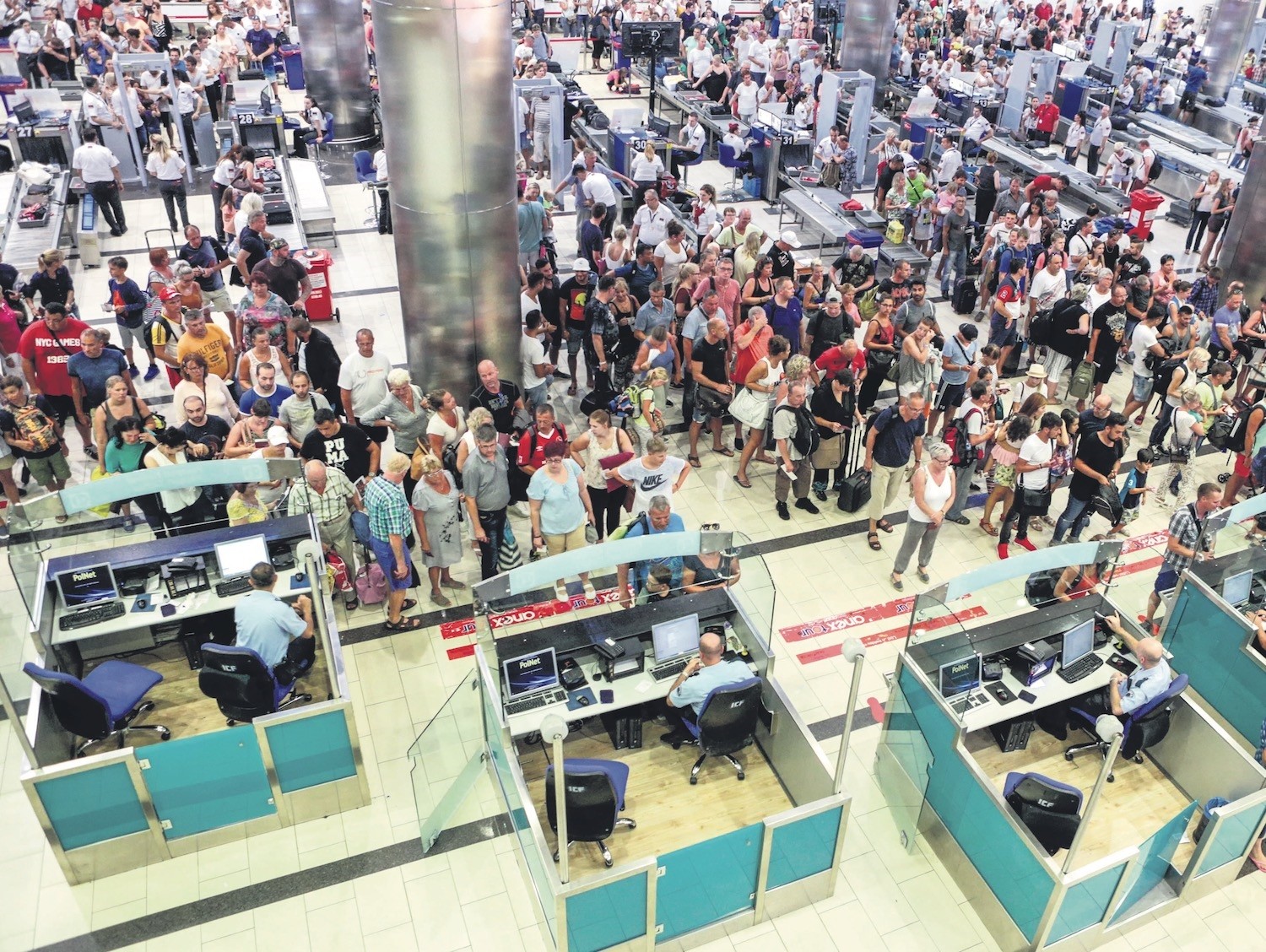 Tourists wait for security and passport control at Antalya International Airport on Sept. 10, 2016.