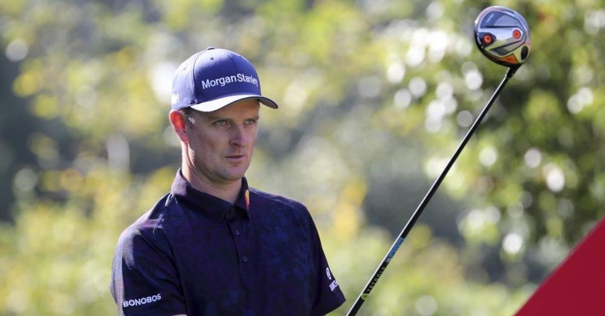Justin Rose lines up his shot for the HSBC Champions golf tournament, Shanghai, Nov. 1, 2019. (AP Photo) 