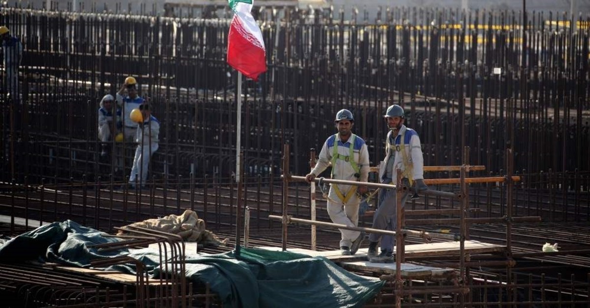 A picture taken on November 10, 2019, shows workers on a construction site in Iran's Bushehr nuclear power plant. (AFP Photo)