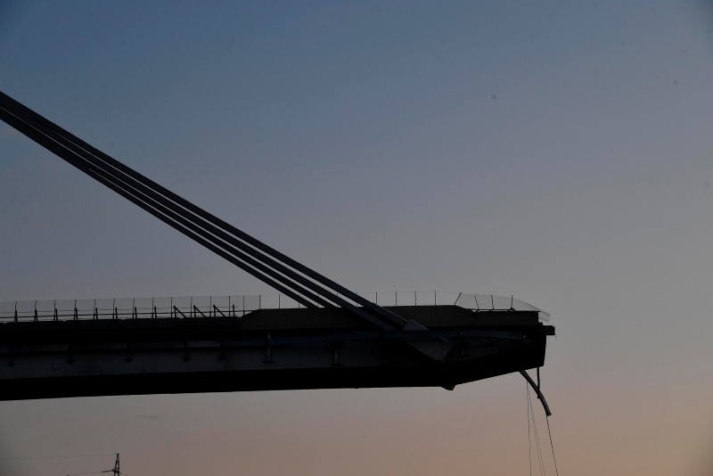 A view of the partially collapsed Morandi highway bridge in Genoa, Italy, Thursday, Aug. 16, 2018. (AP Photo)