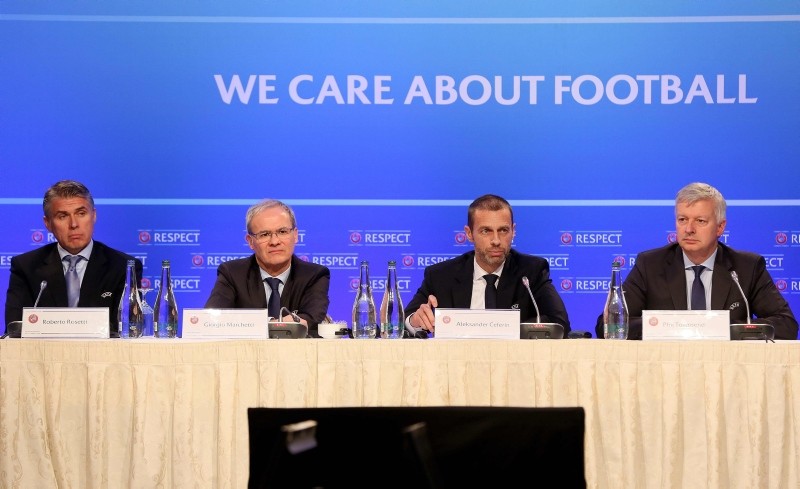 UEFA President Aleksander Ceferin (2R), Deputy Secretary General Giorgio Marchetti (2L), Chief Refereeing Officer Roberto Rosetti (L) and Managing Director of Communications Phil Townsend attend a press conference in Dublin on Dec. 3, 2018. (AFP)