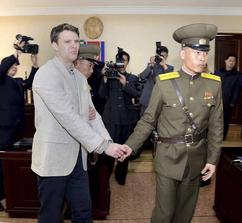 A file handout photo provided by the official Korean Central News Agency shows Otto Frederick Warmbier (L) in relation to his trial in Pyongyang, North Korea, 16 March 2016. (EPA Photo)