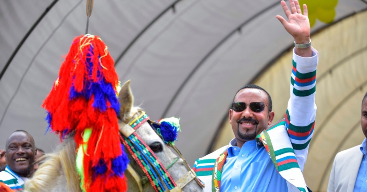 In this file photo taken on September 15, 2019 Ethiopian Prime Minister Abiy Ahmed gestures after receiving a horse as a gift from the elders of the Kafficho ethnic group during a visit to Bonga, the main town in Kaffa province. (AFP Photo)
