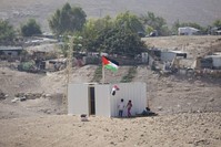 Palestinian girls sit by a newly made shed in the West Bank Bedouin community of Khan al-Ahmar, Sept. 11, 2018. (AP Photo)