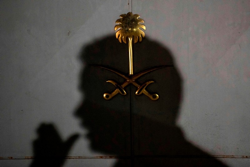 A Saudi official stands at the back door of the Saudi Consulate as Turkish forensic police officers conduct a second investigation in Istanbul, on October 17, 2018. (AFP Photo)