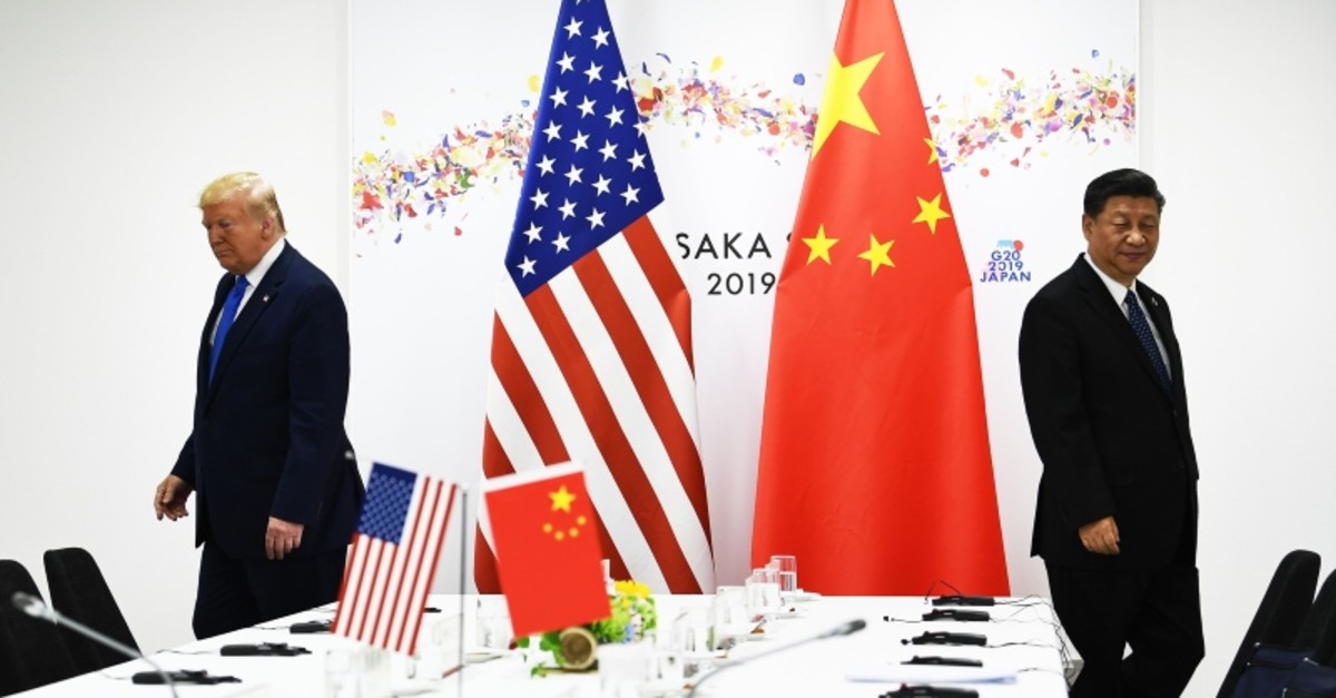 In this file photo taken on June 29, 2019 Chinese President Xi Jinping (R) and US President Donald Trump attend their bilateral meeting on the sidelines of the G20 Summit in Osaka. (AFP Photo)