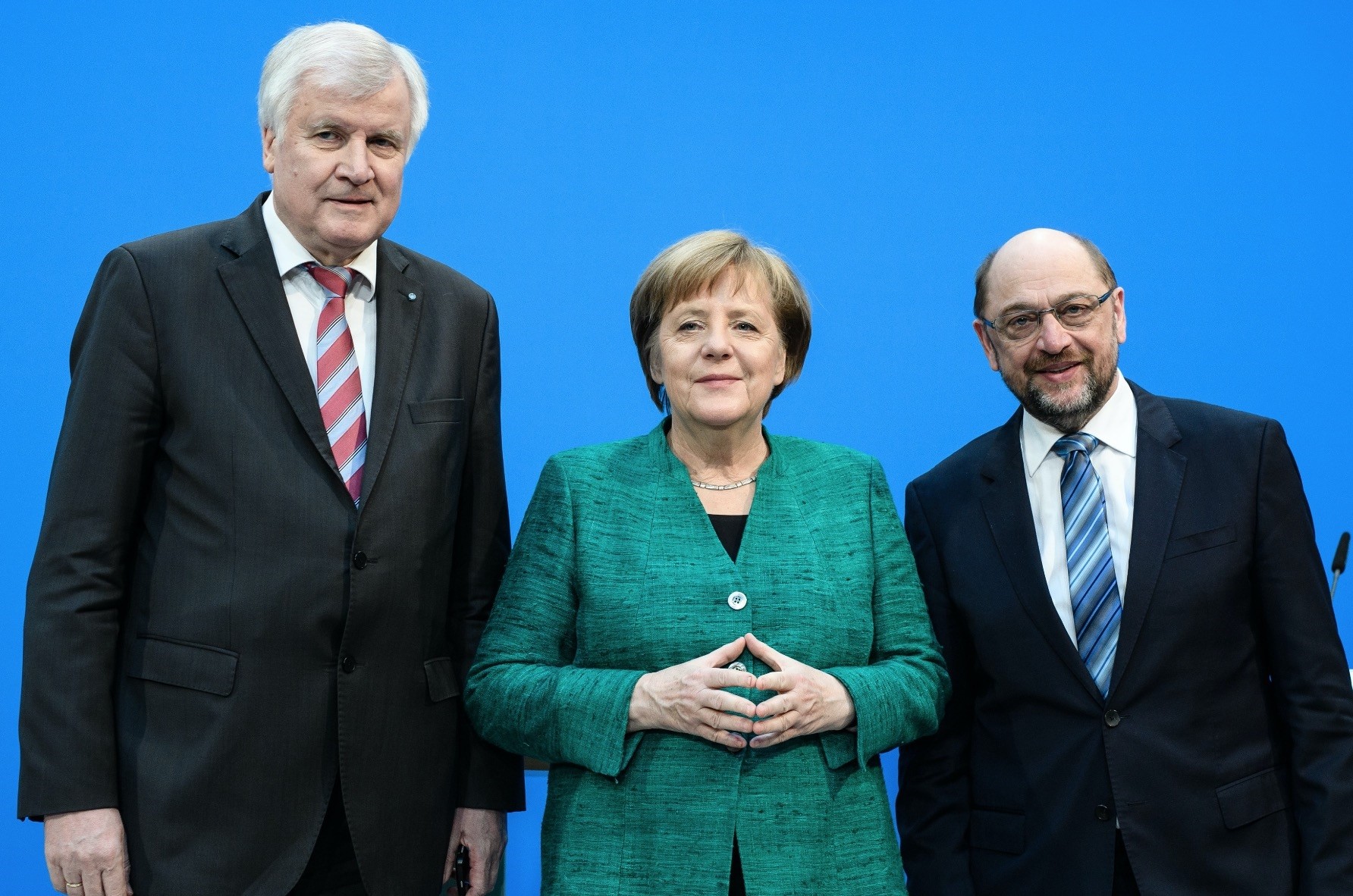 (From left to right) CSU leader Seehofer,  CDU leader and Chancellor Merkel and SPD leader Schulz during a press statement following coalition talks, Berlin, Feb. 7. 