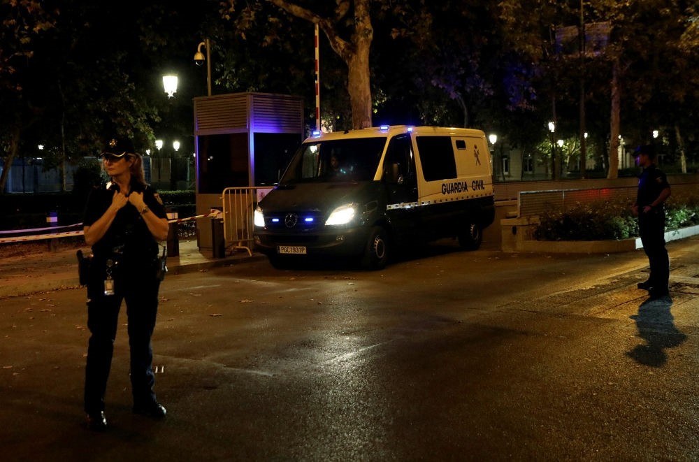 A Spanish Civil Guard van carrying the leaders of two pro-independence groups leaves the High Court in Madrid, Oct. 16.